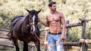 Athletic Guy Shirtless in Jeans with a Horse